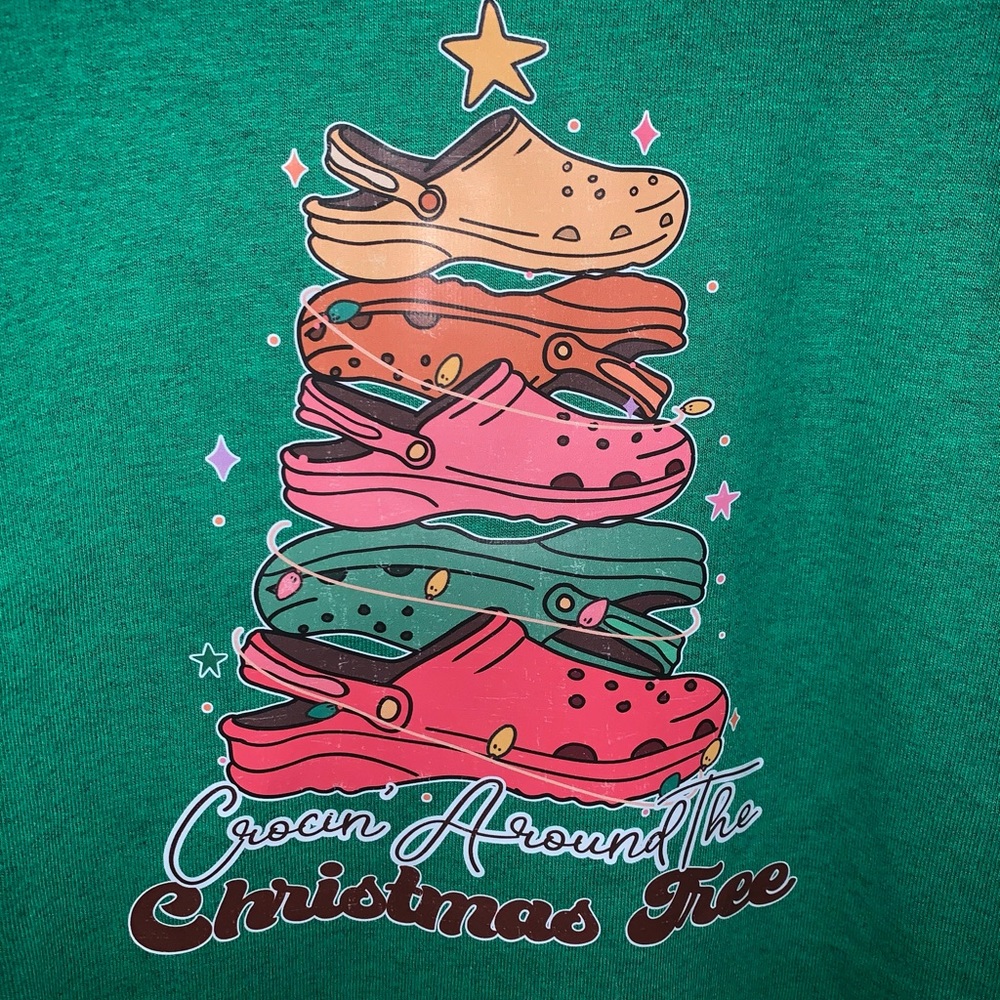 Everyone loves a tee shirt Crocin around the Christmas tree